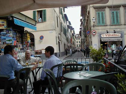 A few gentlemen relaxing at the local cafe